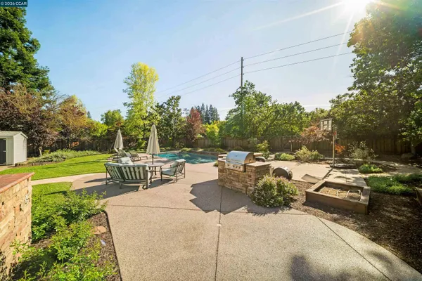 a view of a backyard with sitting area