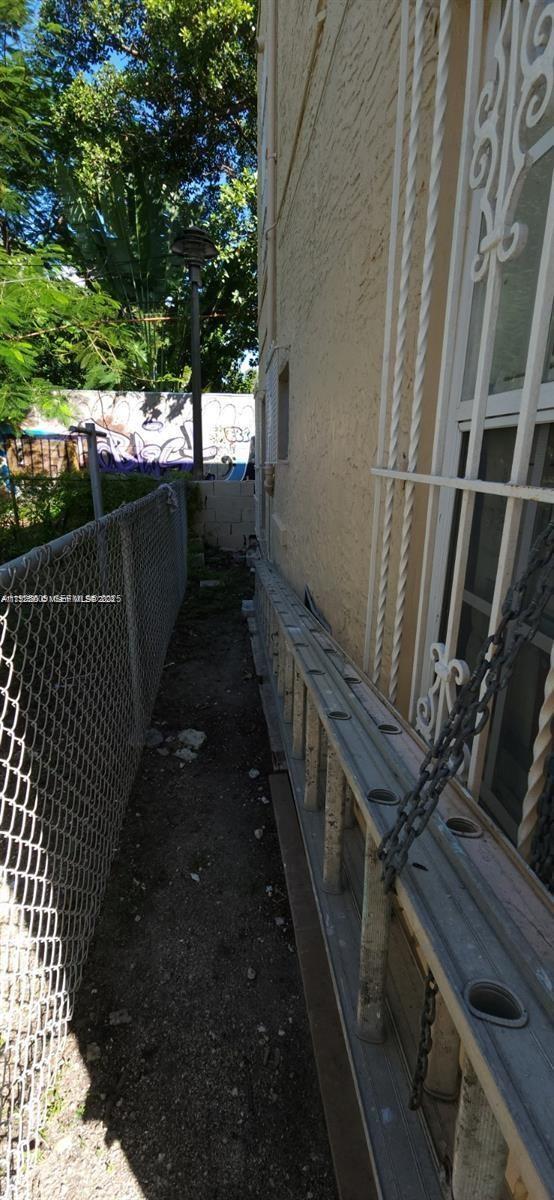 251 Northwest 34th Terrace Miami, FL 33127 - Photo 11 of 12 a balcony with wooden floor