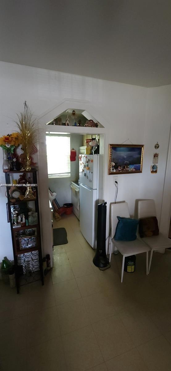 251 Northwest 34th Terrace Miami, FL 33127 - Photo 2 of 12 a room with furniture and a window