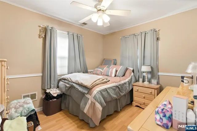 a bedroom with bed and a window