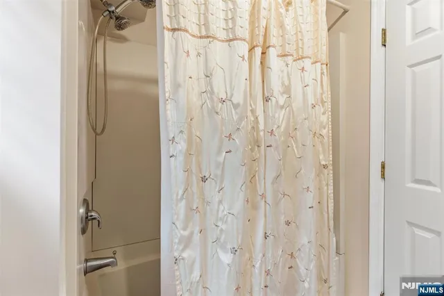 a bathroom with a glass shower door