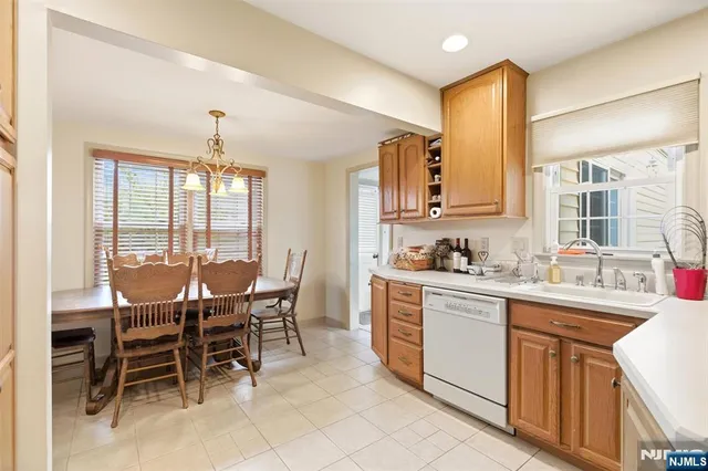a view of a dining room with furniture and window