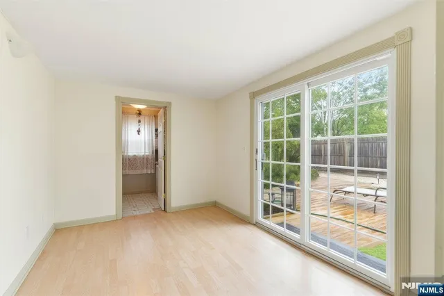 a view of empty room with floor to ceiling window
