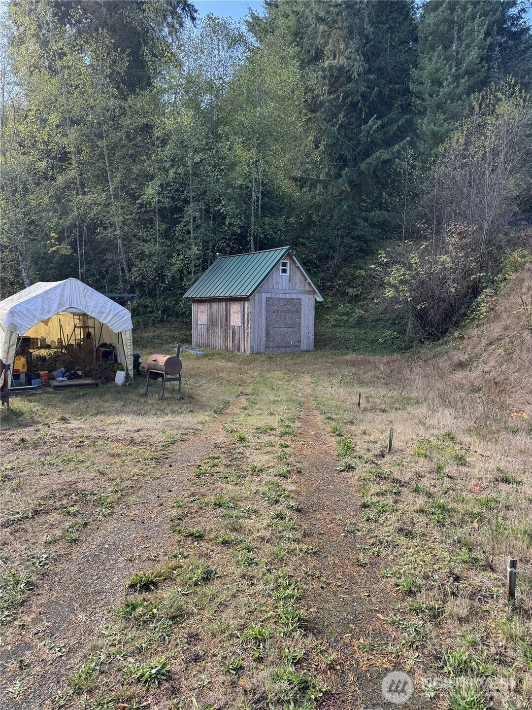 0 Northwest Sigurd Hanson Road Silverdale, WA 98383 - Photo 17 of 24 a view of a house with a yard