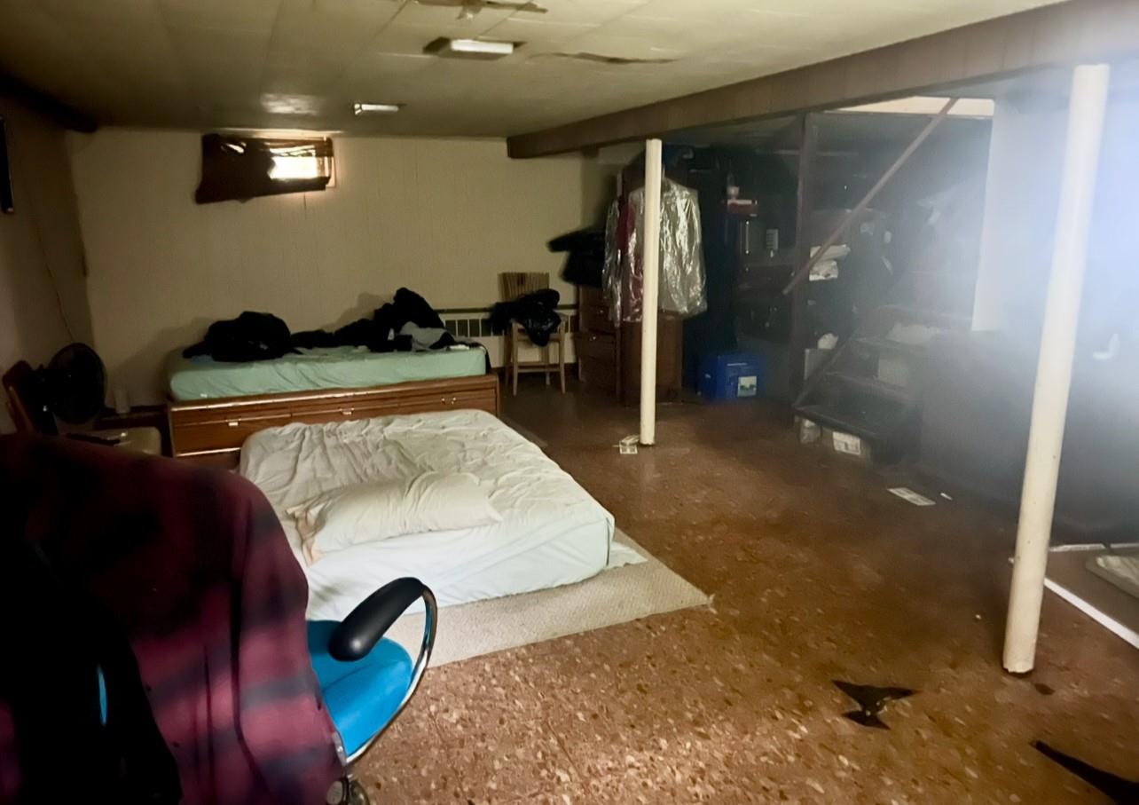 100 Maple Lane Medford, NY 11763 - Photo 9 of 13 Bedroom with concrete floors