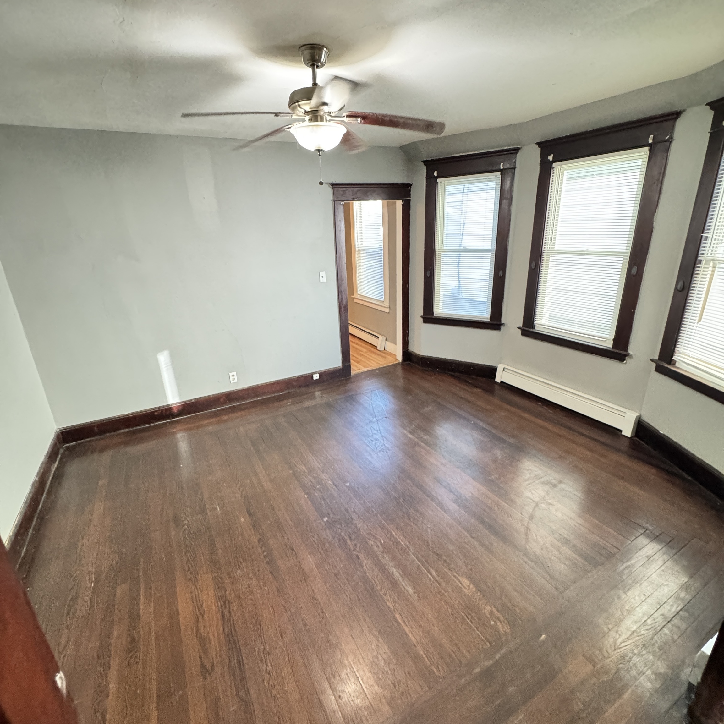 89 Beacon Street, Unit 1 Hamden, CT 06514 - Photo 4 of 11 wooden floor in an empty room with a window