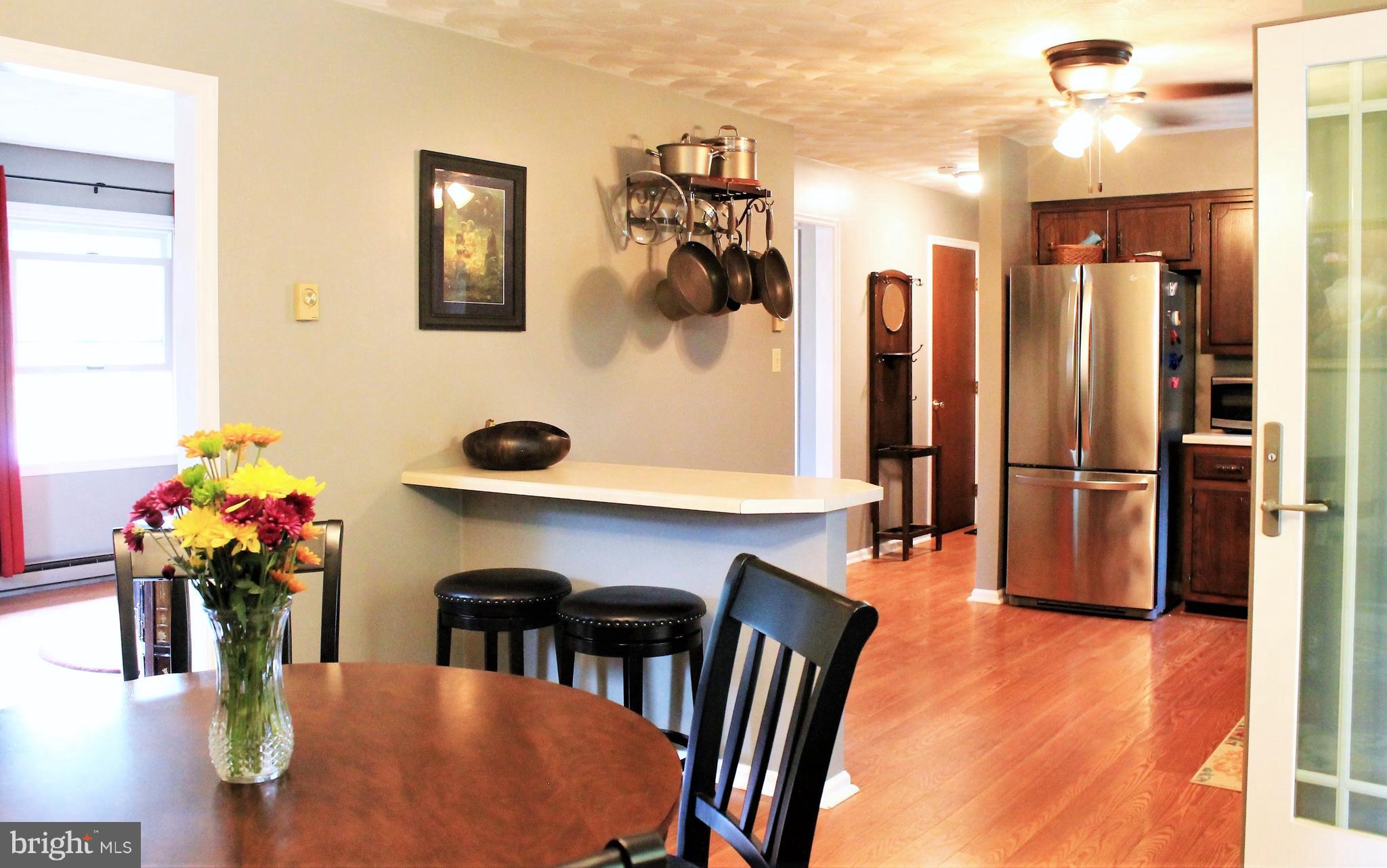 115 Mine Road Hershey, PA 17033 - Photo 13 of 39 Kitchen Flows into Half Bath and Garage Entry