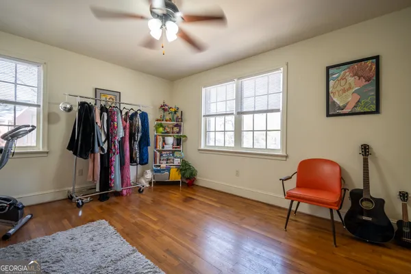 a view of a room with gym equipment and windows