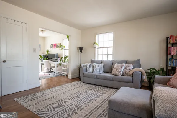a living room with furniture and a window