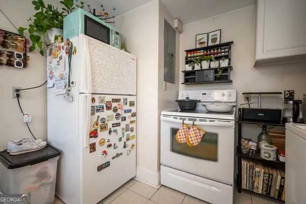 a kitchen with stainless steel appliances a refrigerator and a stove top oven