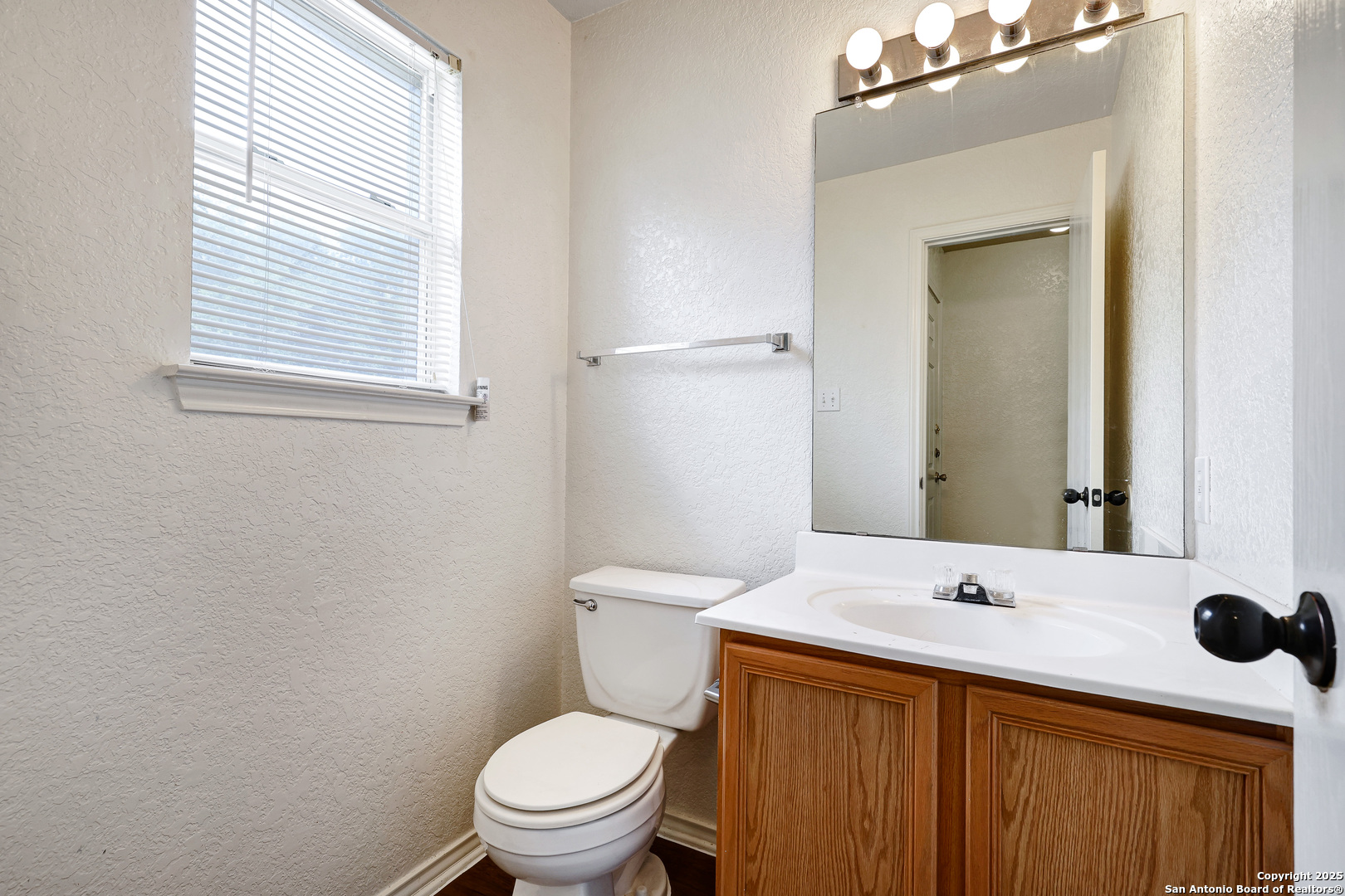 8014 Sandbar San Antonio, TX 78254 - Photo 14 of 30 a bathroom with a sink a toilet and mirror