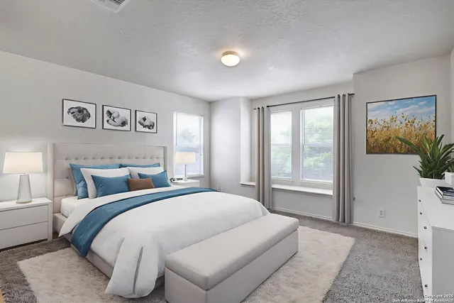 a spacious bedroom with a large bed and a window