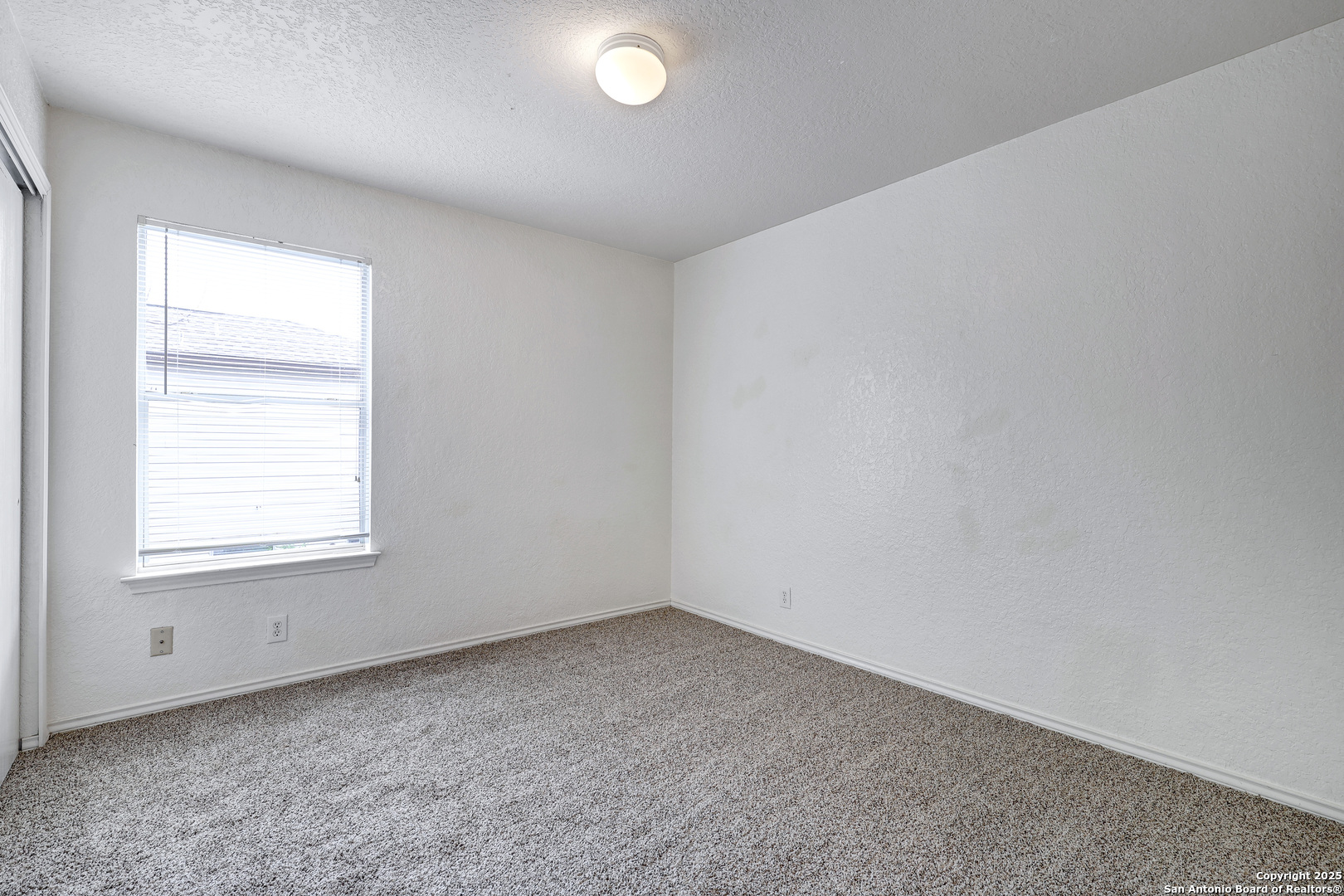 8014 Sandbar San Antonio, TX 78254 - Photo 21 of 30 an empty room with a window