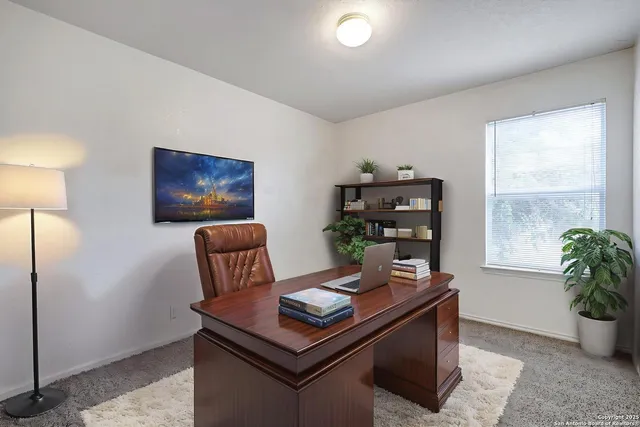 a living room with furniture and window