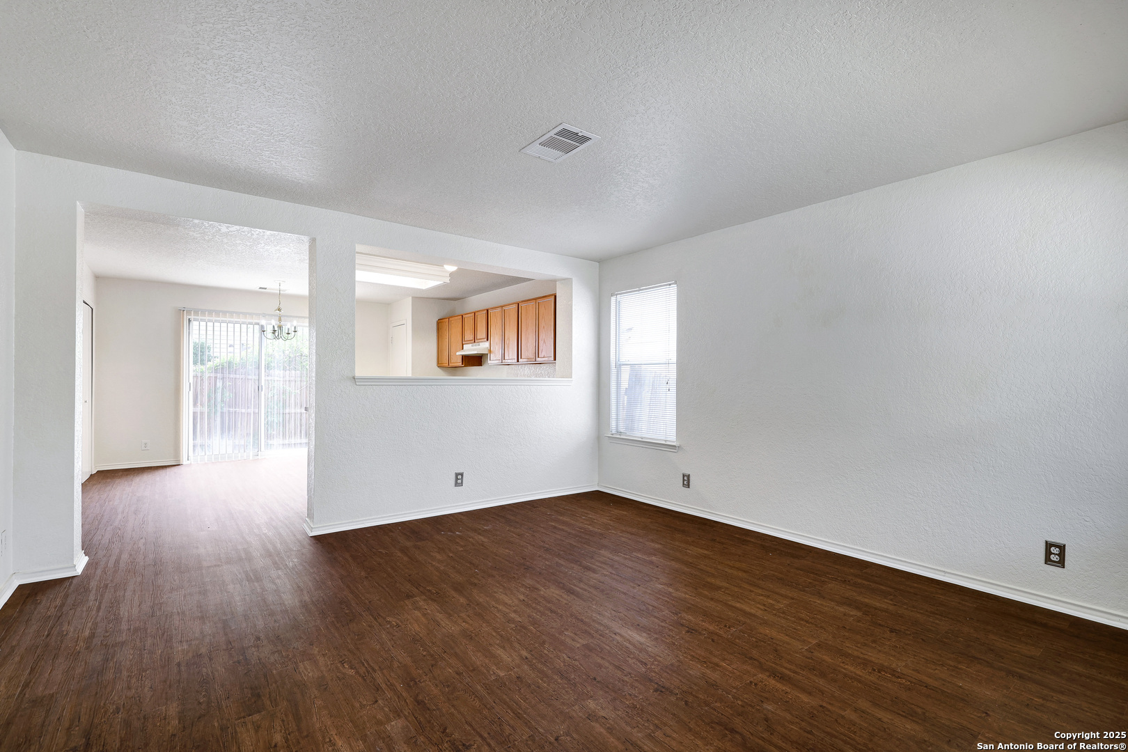 8014 Sandbar San Antonio, TX 78254 - Photo 7 of 30 an empty room with wooden floor and windows