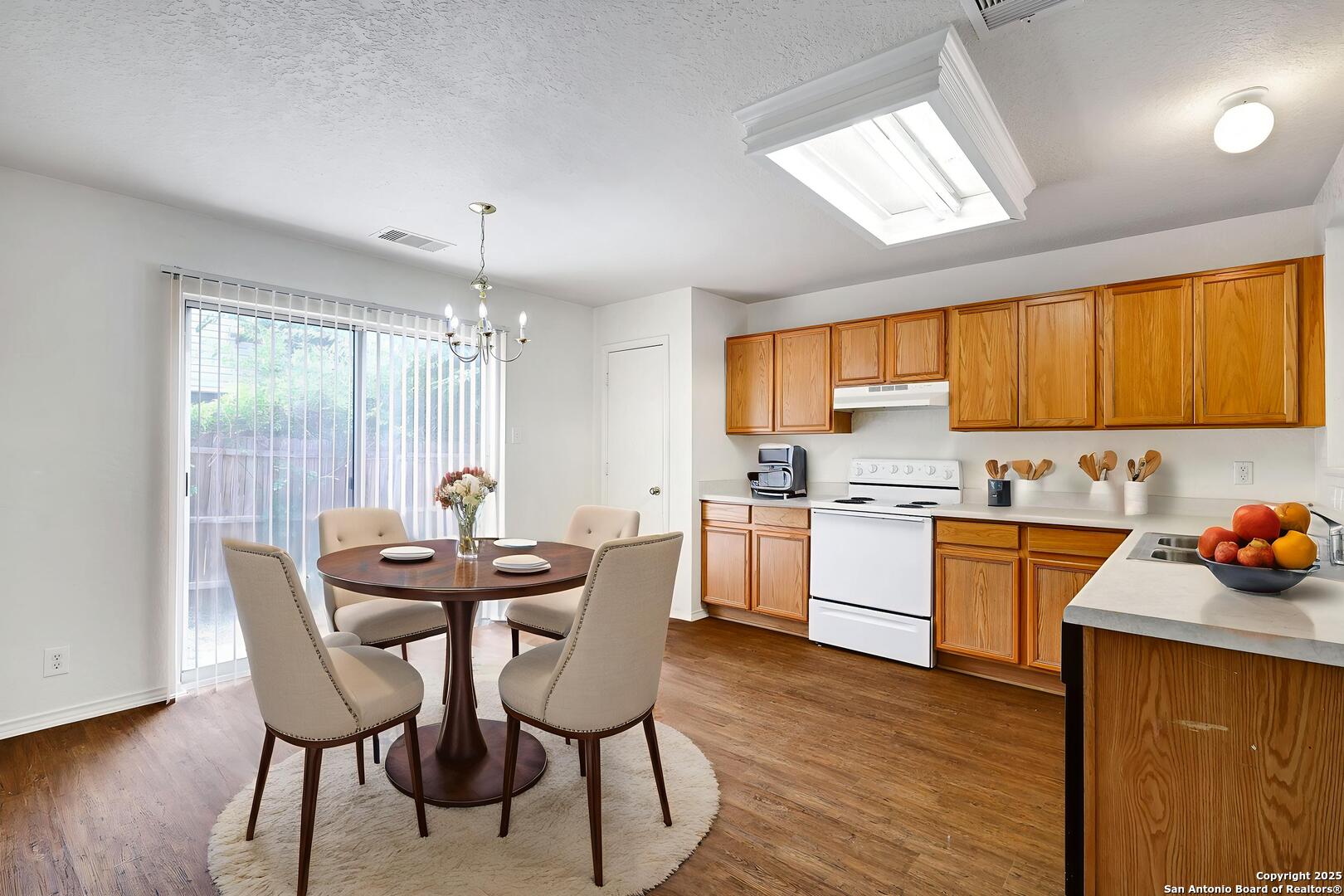 8014 Sandbar San Antonio, TX 78254 - Photo 8 of 30 a kitchen that has a table and chairs in it