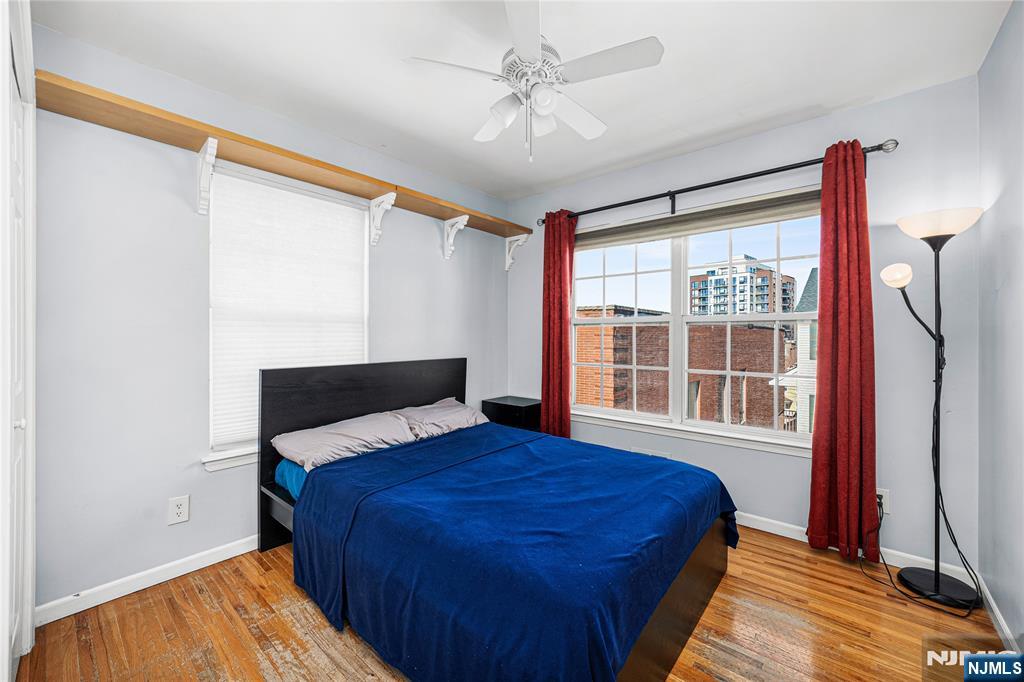 84 Union Street Newark, NJ 07105 - Photo 30 of 39 a bedroom with a large bed and a window