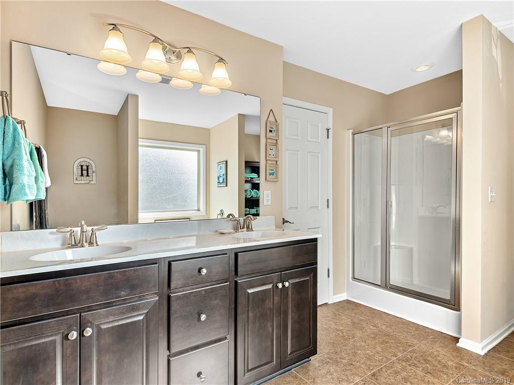 125 North River Road Fletcher, NC 28732 - Photo 12 of 18 a bathroom with a sink vanity and a mirror