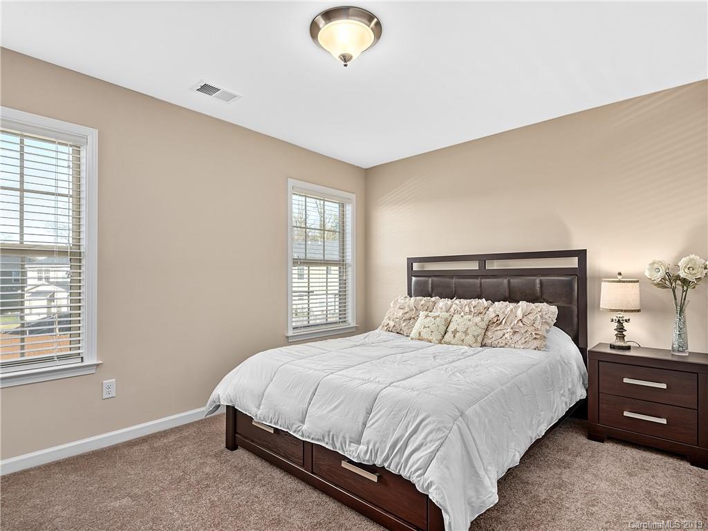 125 North River Road Fletcher, NC 28732 - Photo 13 of 18 a bedroom with a bed and window