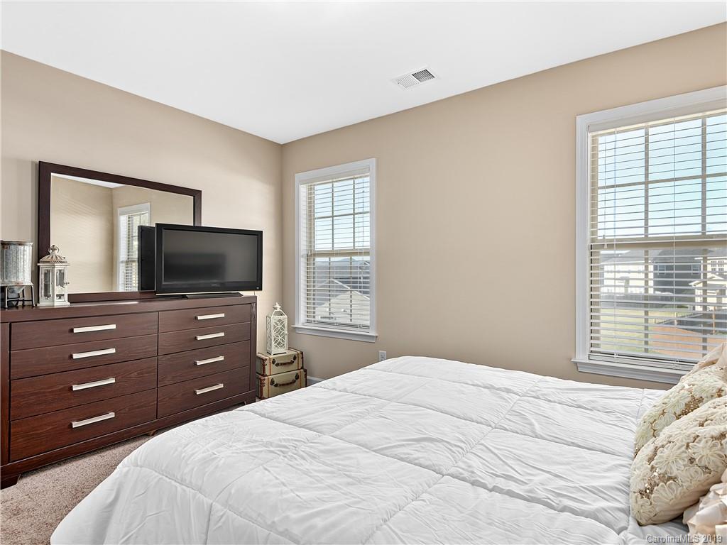 125 North River Road Fletcher, NC 28732 - Photo 14 of 18 a bedroom with a bed and a flat screen tv