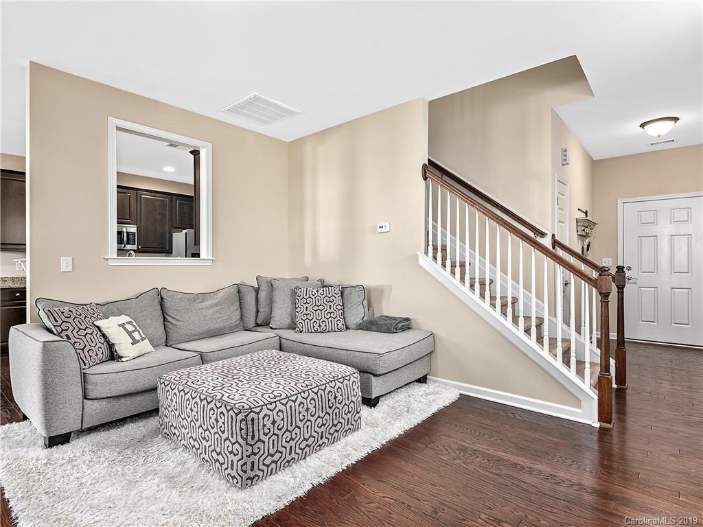 125 North River Road Fletcher, NC 28732 - Photo 4 of 18 a living room with furniture and a wooden floor