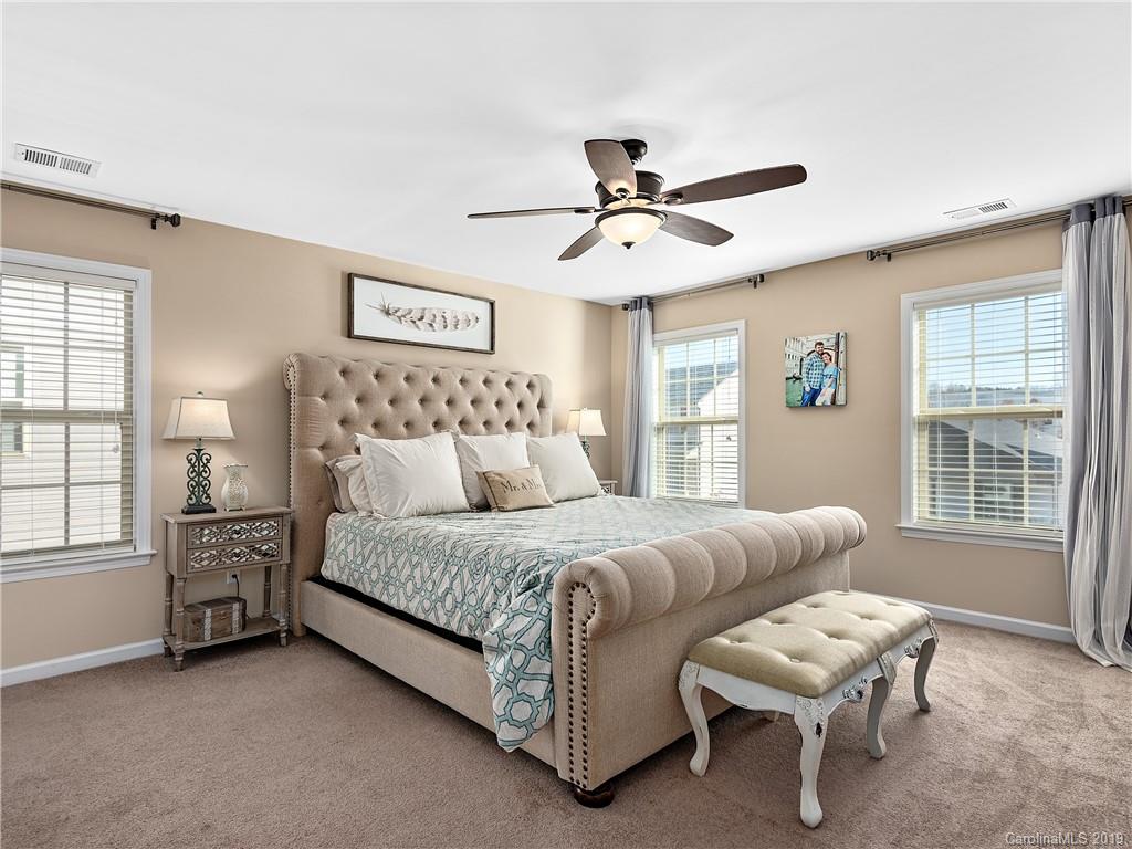 125 North River Road Fletcher, NC 28732 - Photo 9 of 18 a spacious bedroom with a bed and a window