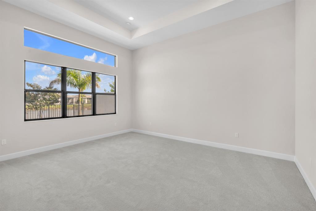 10990 Violet Mdw Street Boynton Beach, FL 33473 - Photo 12 of 60 an empty room with windows