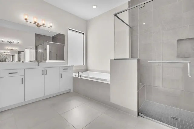 a bathroom with a glass shower door