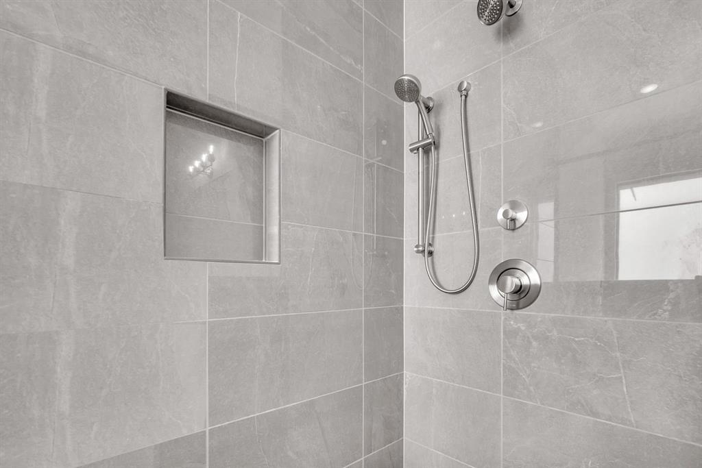 10990 Violet Mdw Street Boynton Beach, FL 33473 - Photo 17 of 60 a bathroom with a glass shower door