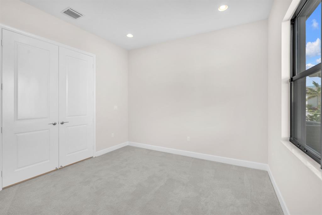 10990 Violet Mdw Street Boynton Beach, FL 33473 - Photo 18 of 60 a view of an empty room