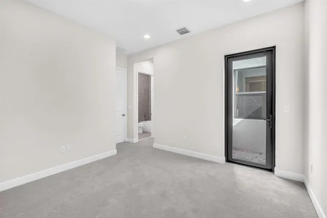 an aerial view of a house with swimming pool and a yard