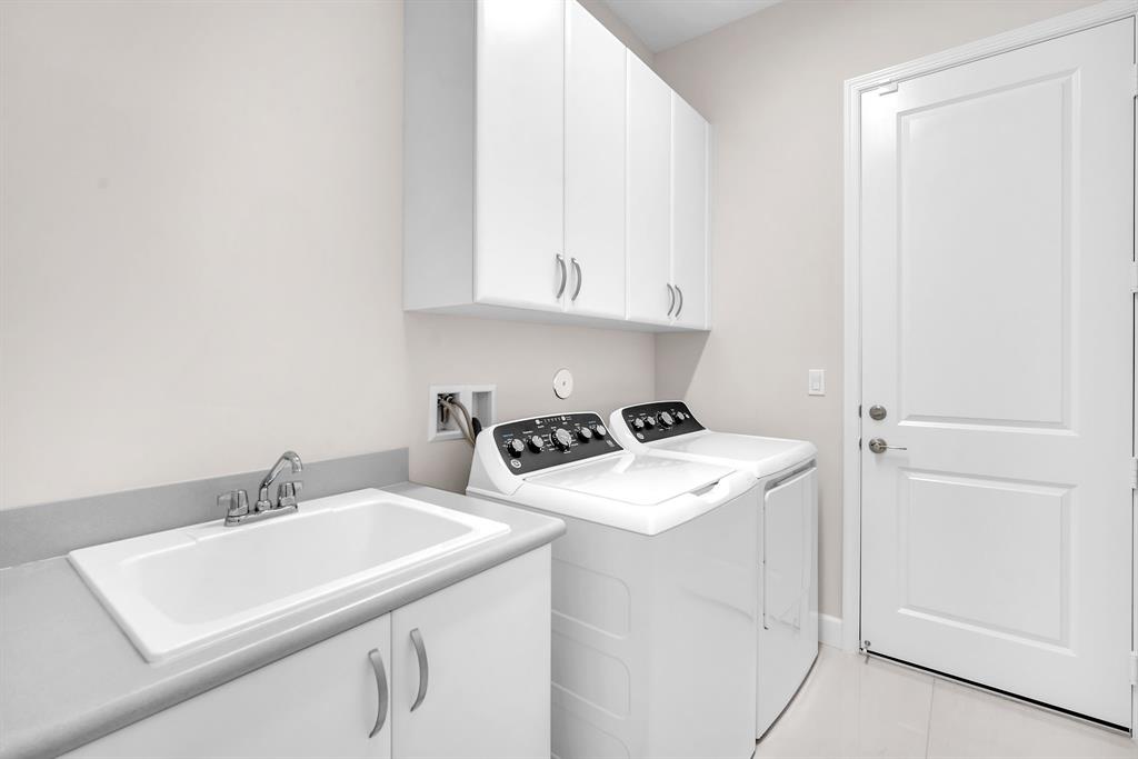 10990 Violet Mdw Street Boynton Beach, FL 33473 - Photo 27 of 60 a utility room with dryer and washer