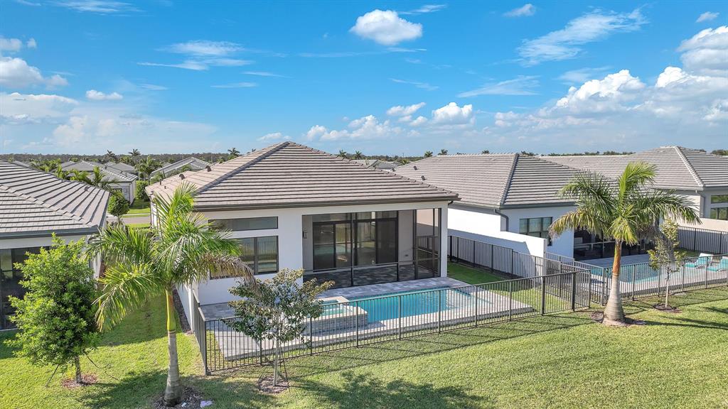 10990 Violet Mdw Street Boynton Beach, FL 33473 - Photo 28 of 60 a view of a house with backyard porch and sitting area