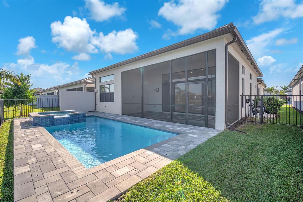 10990 Violet Mdw Street Boynton Beach, FL 33473 - Photo 31 of 60 a view of a backyard of the house
