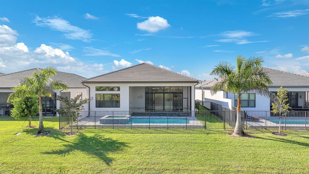 10990 Violet Mdw Street Boynton Beach, FL 33473 - Photo 35 of 60 a swimming pool with outdoor seating yard and porch