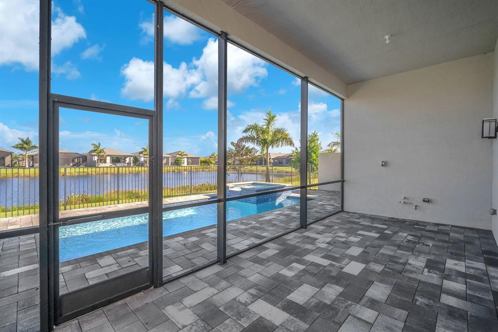 10990 Violet Mdw Street Boynton Beach, FL 33473 - Photo 37 of 60 a view of an empty room with large windows