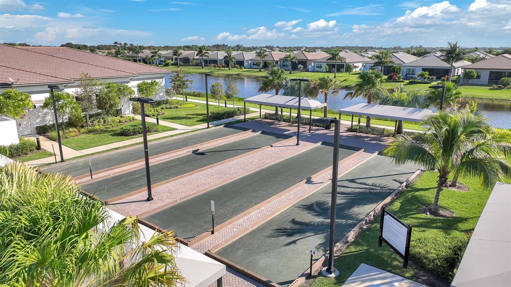 10990 Violet Mdw Street Boynton Beach, FL 33473 - Photo 48 of 60 a view of a swimming pool with a patio