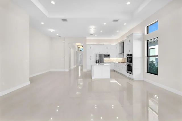 a view of kitchen with furniture and wooden floor