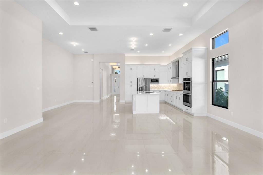 10990 Violet Mdw Street Boynton Beach, FL 33473 - Photo 7 of 60 a view of kitchen with furniture and wooden floor