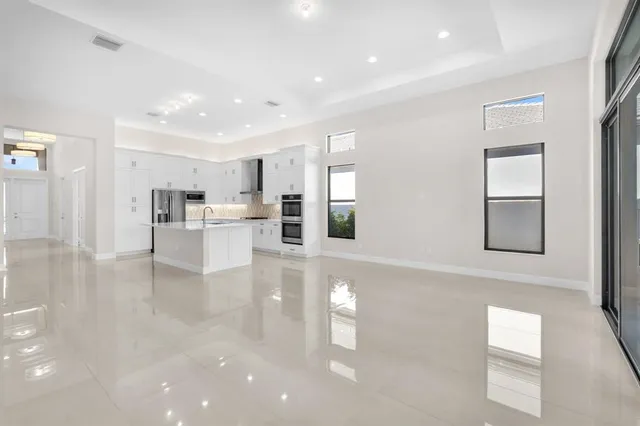 a view of kitchen with furniture and wooden floor
