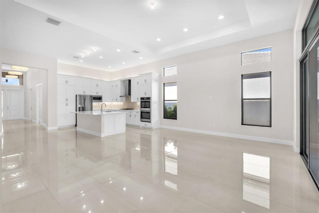 10990 Violet Mdw Street Boynton Beach, FL 33473 - Photo 8 of 60 a view of kitchen with furniture and wooden floor