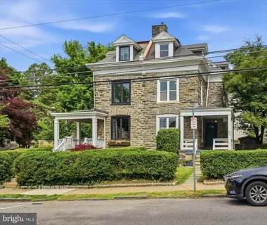 front view of a house with a garden