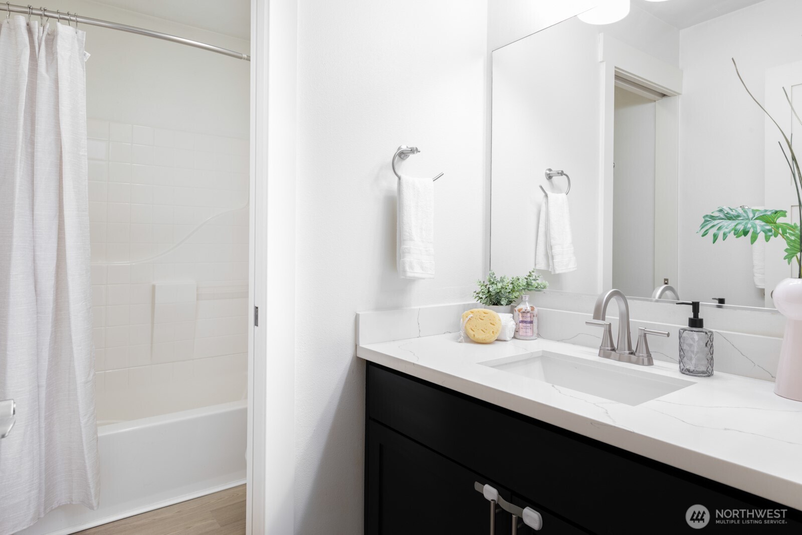 4121 Martin Luther King Jr Way South Seattle, WA 98108 - Photo 14 of 17 a bathroom with a sink and a mirror