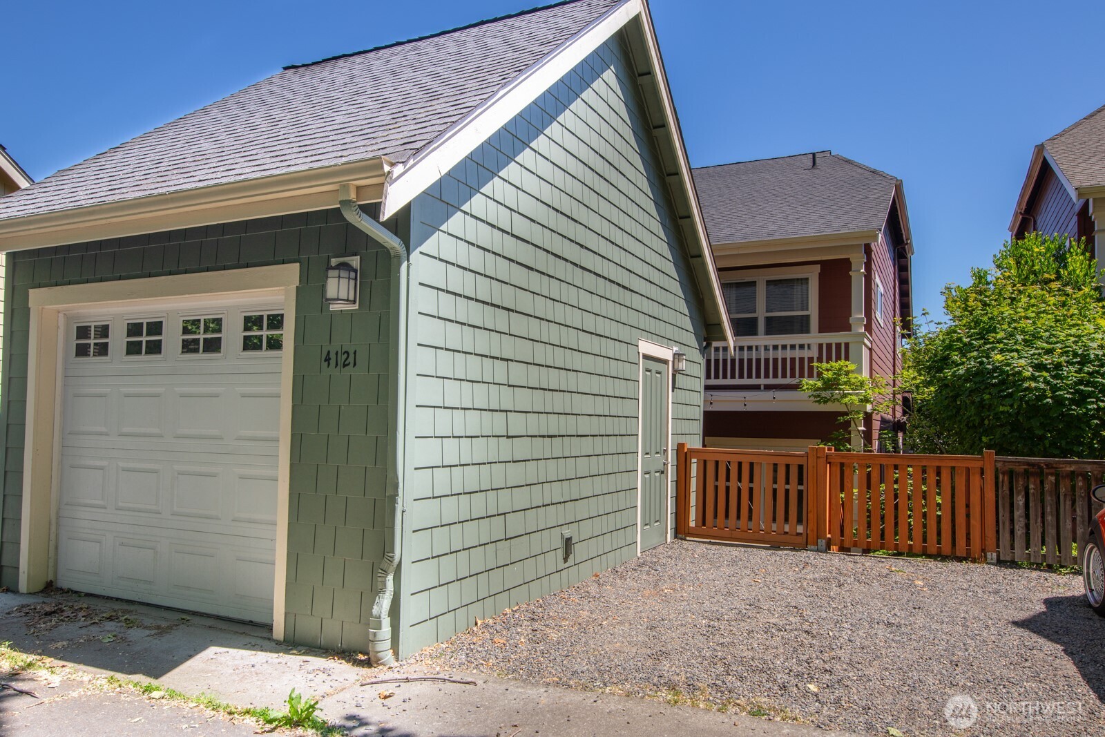 4121 Martin Luther King Jr Way South Seattle, WA 98108 - Photo 16 of 17 a view of a house with a wooden fence