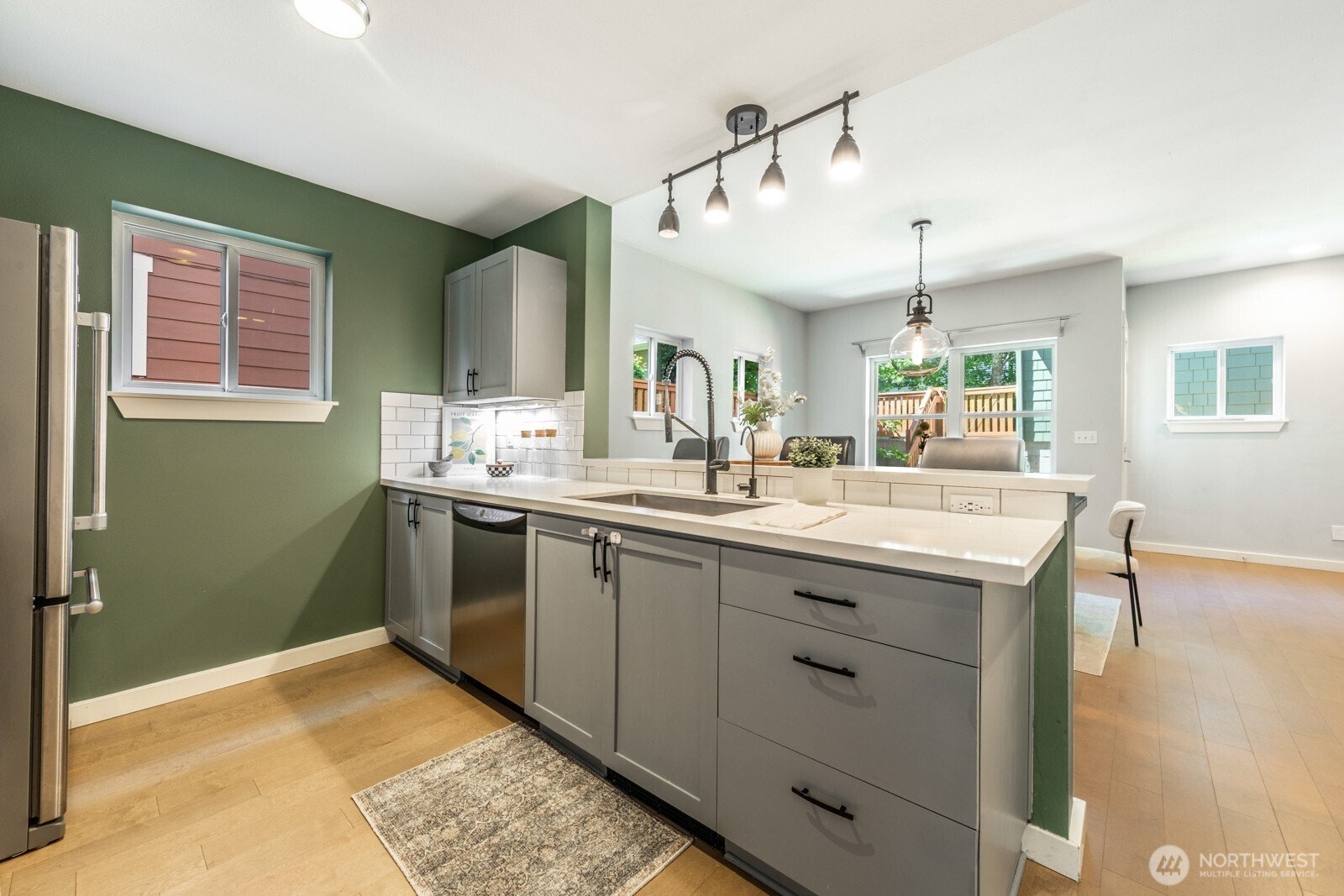 4121 Martin Luther King Jr Way South Seattle, WA 98108 - Photo 2 of 17 a bathroom with a granite countertop sink and a mirror