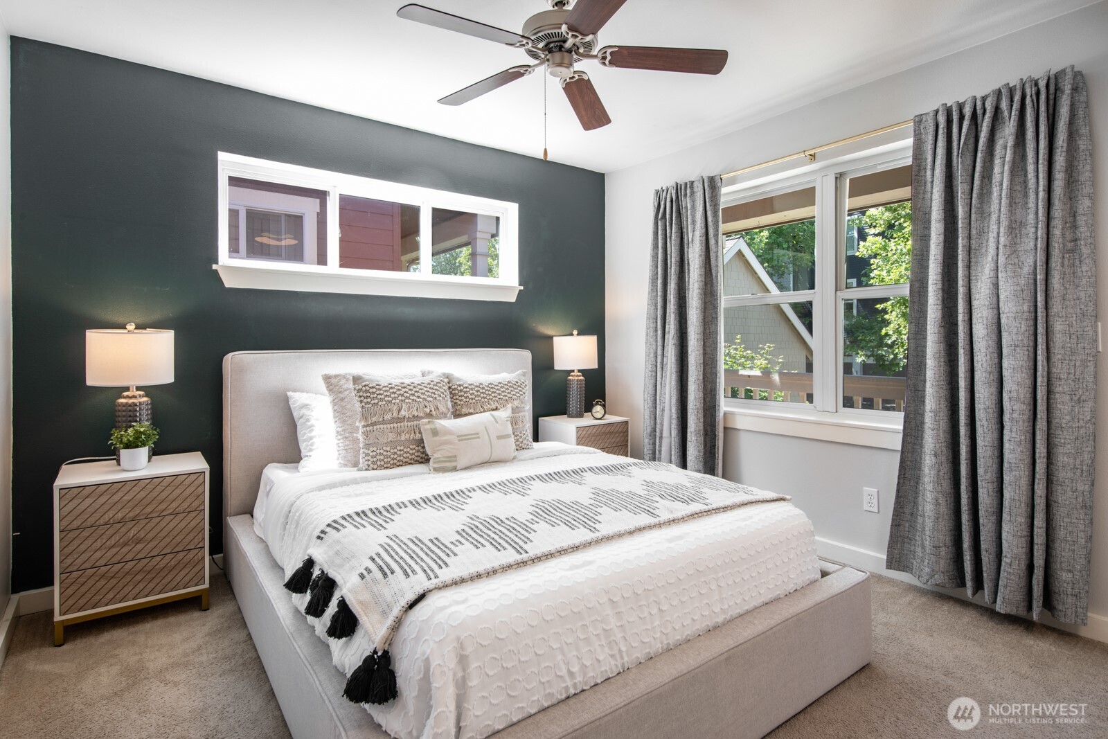 4121 Martin Luther King Jr Way South Seattle, WA 98108 - Photo 7 of 17 a bedroom with a large bed and a window