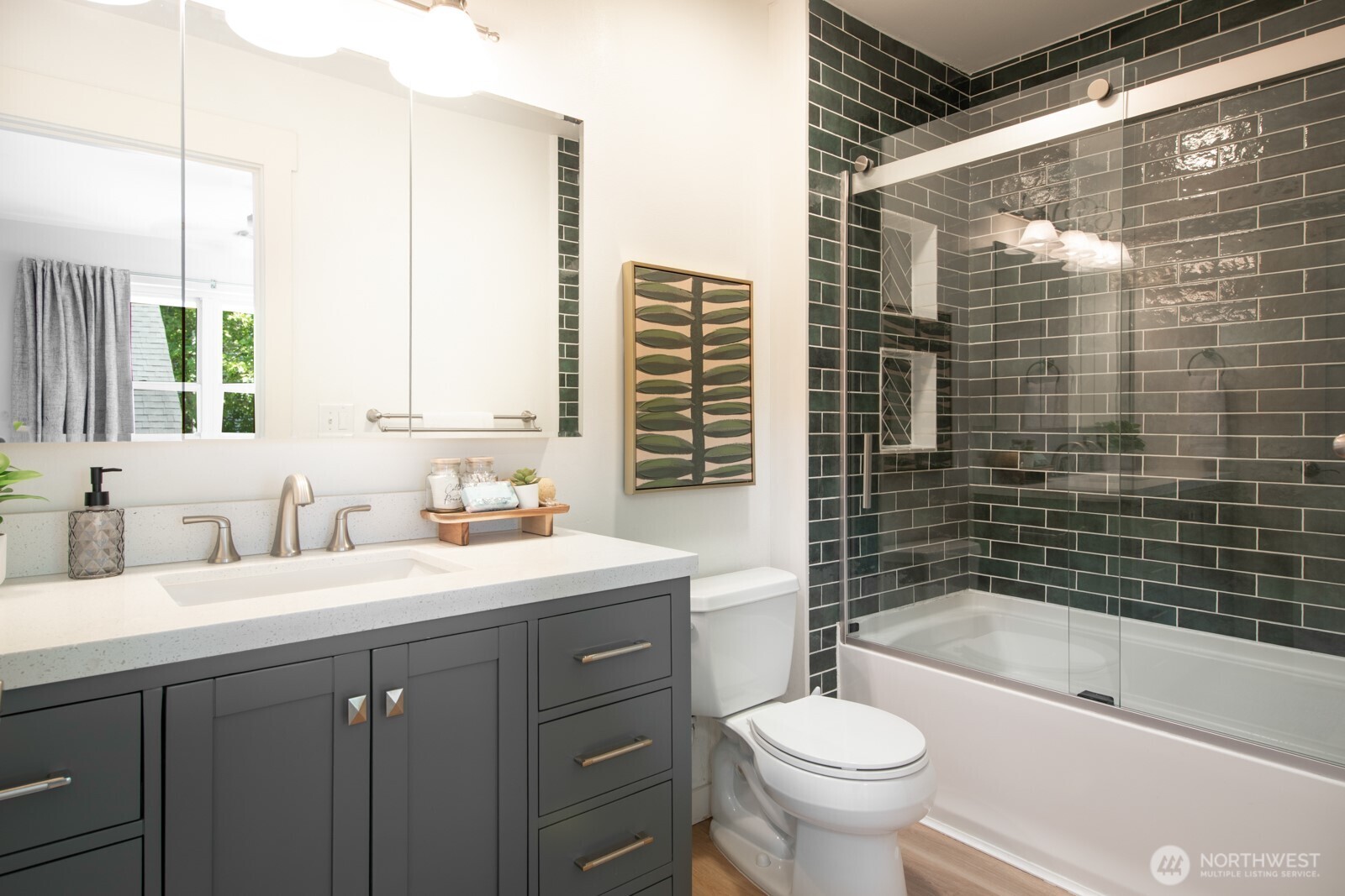 4121 Martin Luther King Jr Way South Seattle, WA 98108 - Photo 9 of 17 a bathroom with a sink a toilet and shower