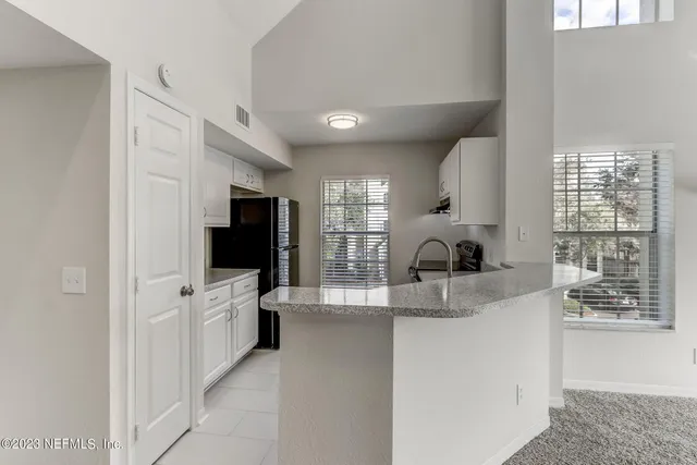 a kitchen that has a sink and a stove