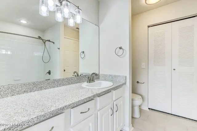 a bathroom with a bath tub with a shower