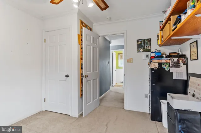 a white toilet sitting next to a bathroom sink